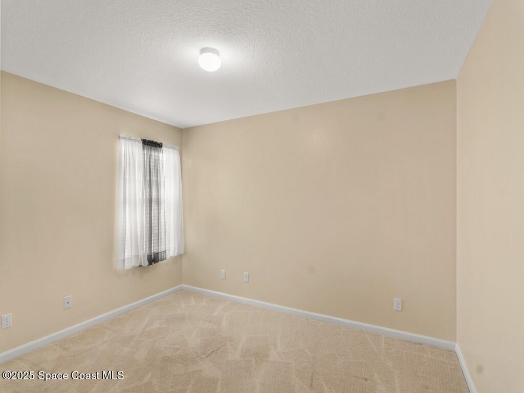 4026 Meander Place, Unit 208 Rockledge, FL 32955 - Photo 18 of 32 a view of an empty room