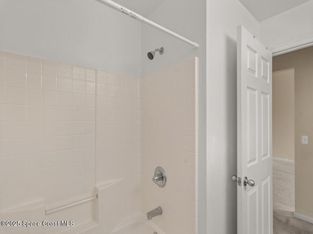 4026 Meander Place, Unit 208 Rockledge, FL 32955 - Photo 23 of 32 a bathroom with a shower