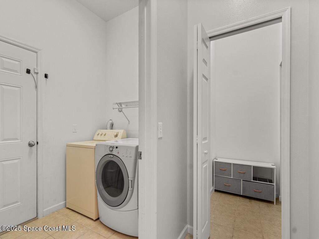 4026 Meander Place, Unit 208 Rockledge, FL 32955 - Photo 24 of 32 a utility room with dryer and washer
