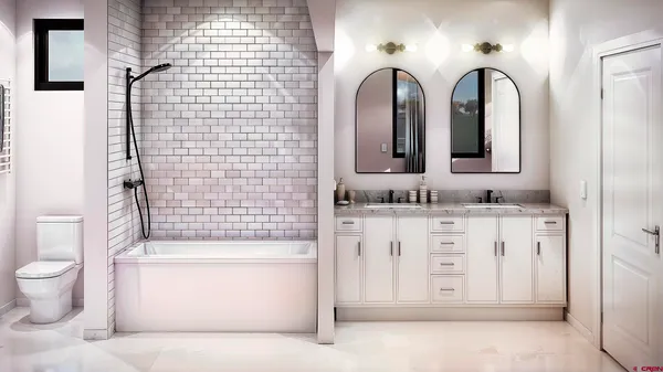 a bathroom with a double vanity sink toilet mirror and shower