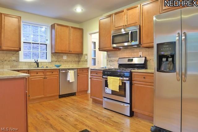 2555 Fenwick Road Cleveland, OH 44118 - Photo 8 of 25 Remodeled Eat-in Kitchen with granite countertops and dual stainless steel sink