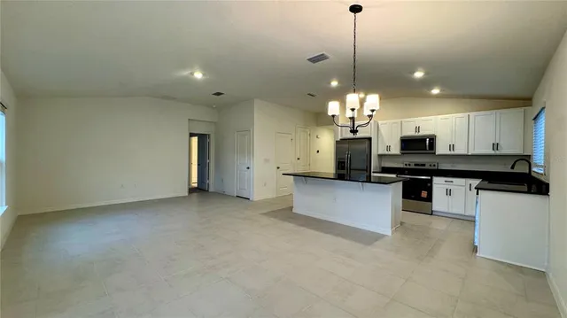 a view of a kitchen with a chandelier
