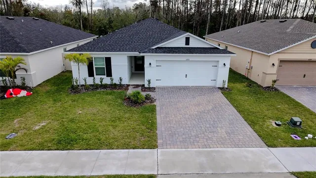 a aerial view of a house with garden