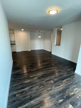 an empty room with wooden floor