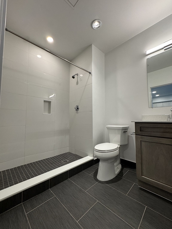 6 Needhams Landing Road, Unit 206 Lynn, MA 01905 - Photo 7 of 12 a bathroom with a toilet a sink and mirror