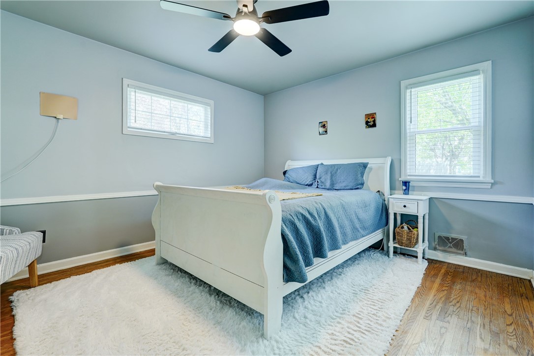 5662 Palmyra Road Pittsford, NY 14534 - Photo 18 of 44 Light filled primary bedroom