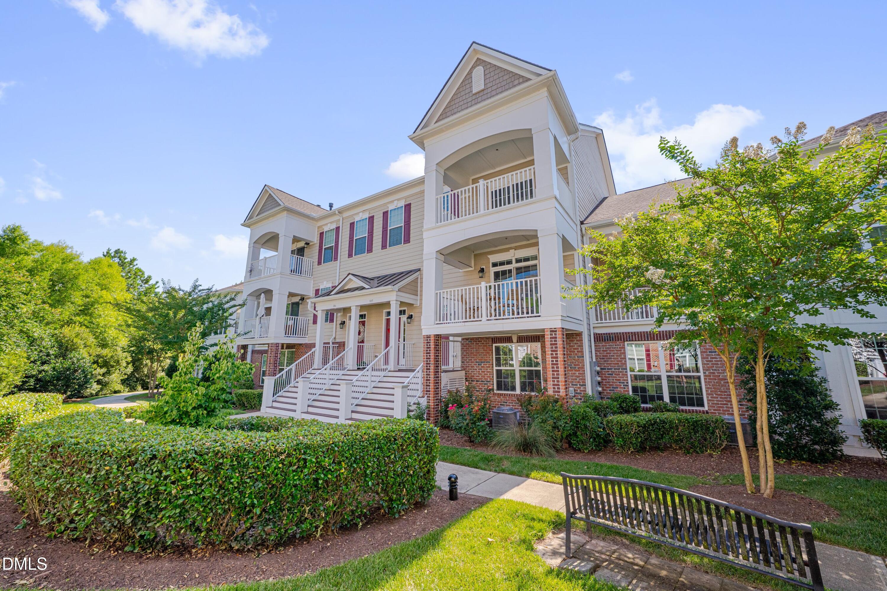10330 Sablewood Drive, Unit 104 Raleigh, NC 27617 - Photo 1 of 39 front view of a brick house with a yard