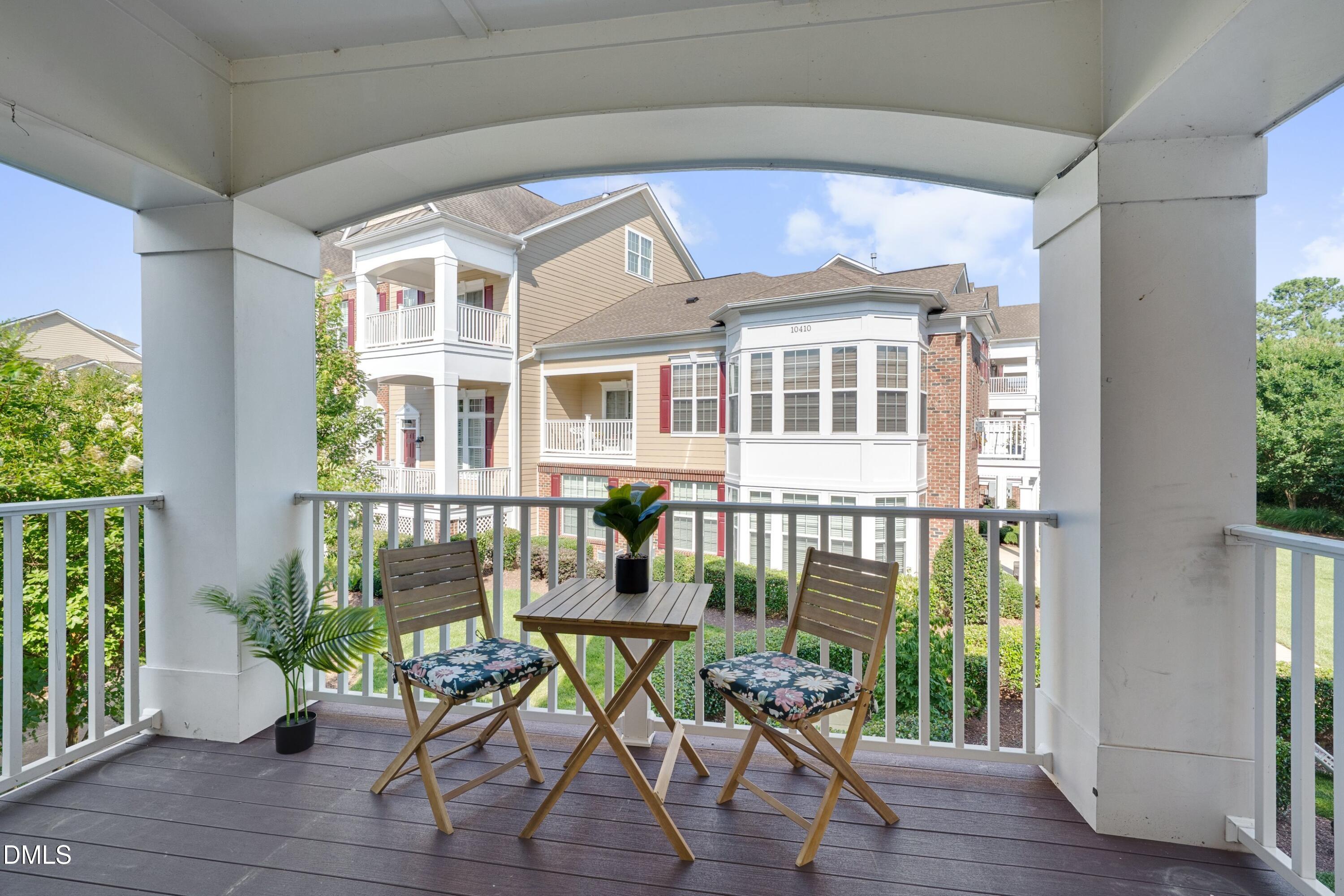 10330 Sablewood Drive, Unit 104 Raleigh, NC 27617 - Photo 10 of 39 a front view of a house with outdoor seating