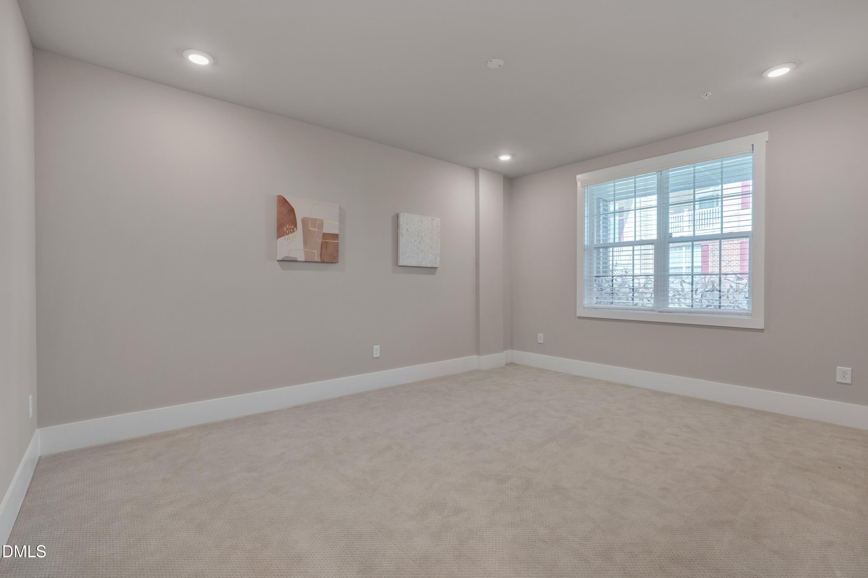 10330 Sablewood Drive, Unit 104 Raleigh, NC 27617 - Photo 23 of 39 an empty room with windows