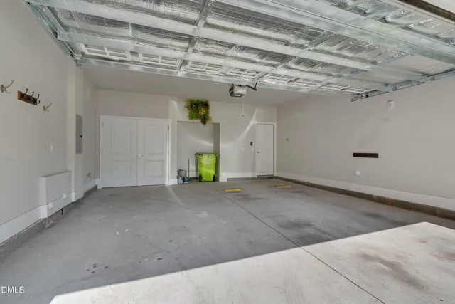 an empty room with windows and bathroom view