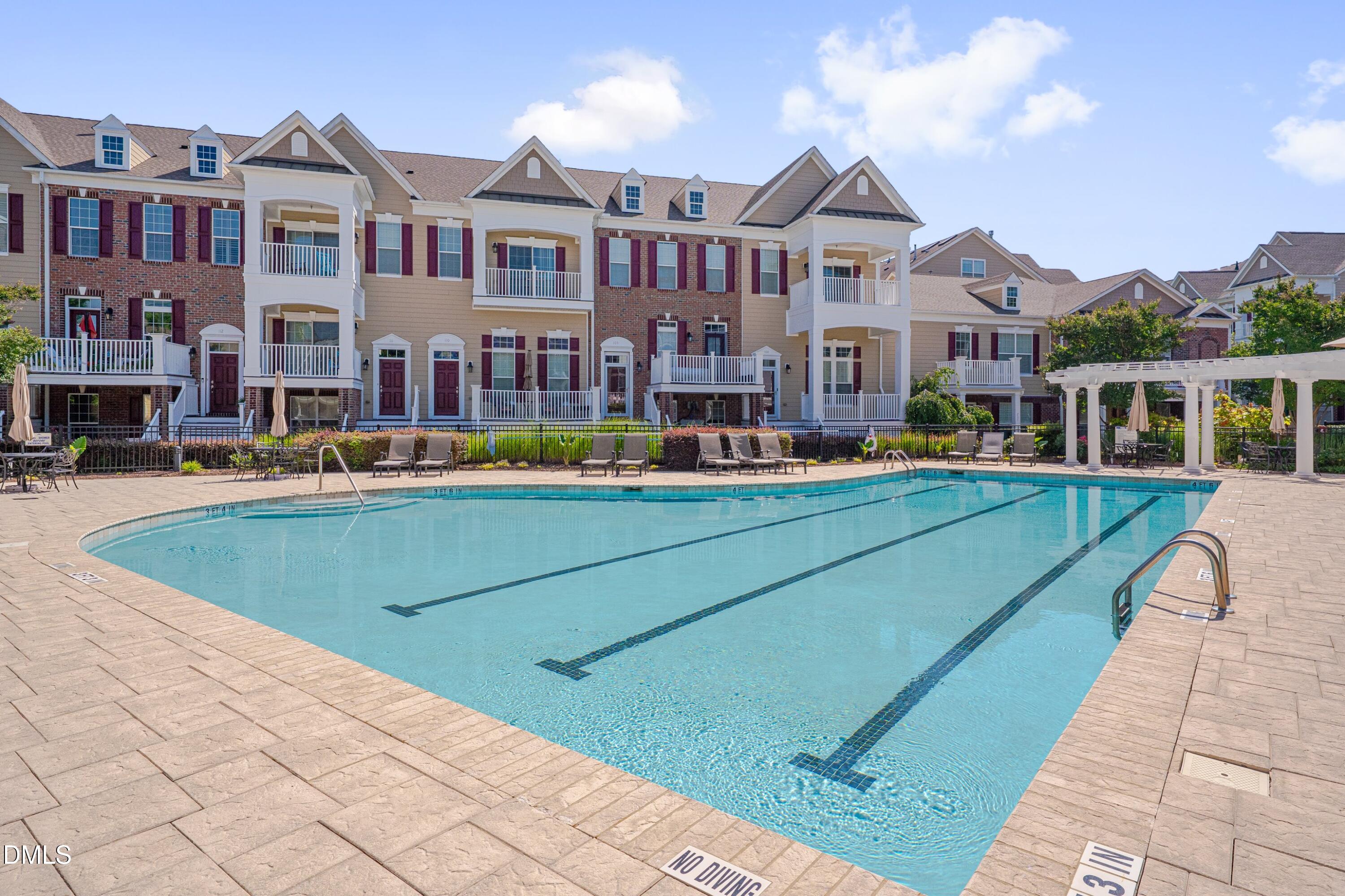 10330 Sablewood Drive, Unit 104 Raleigh, NC 27617 - Photo 27 of 39 a front view of a building with street view and trees