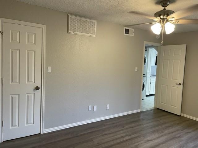 9831 West Walnut Street, Unit 206 Dallas, TX 75243 - Photo 11 of 21 a view of an empty room with wooden floor