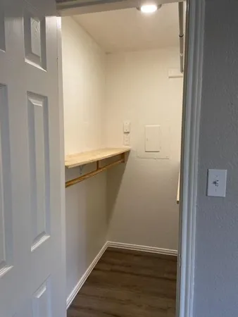 a bathroom with double sink and two mirror