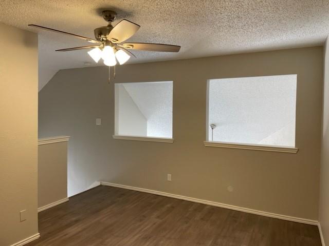 9831 West Walnut Street, Unit 206 Dallas, TX 75243 - Photo 17 of 21 a view of an empty room with wooden floor and a window