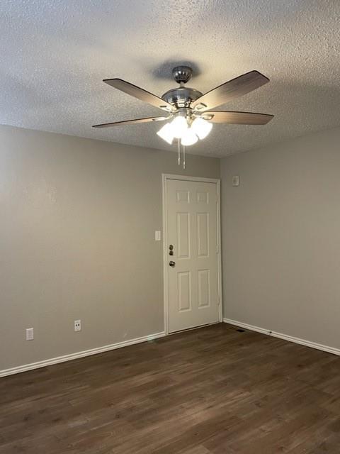 9831 West Walnut Street, Unit 206 Dallas, TX 75243 - Photo 18 of 21 a view of an empty room with wooden floor