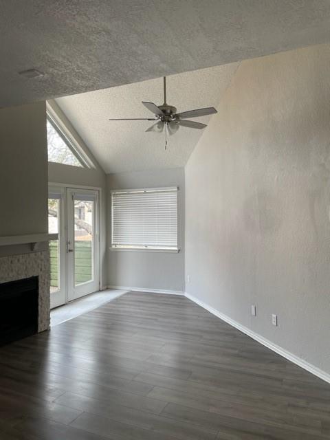 9831 West Walnut Street, Unit 206 Dallas, TX 75243 - Photo 5 of 21 an empty room with wooden floor fireplace and windows