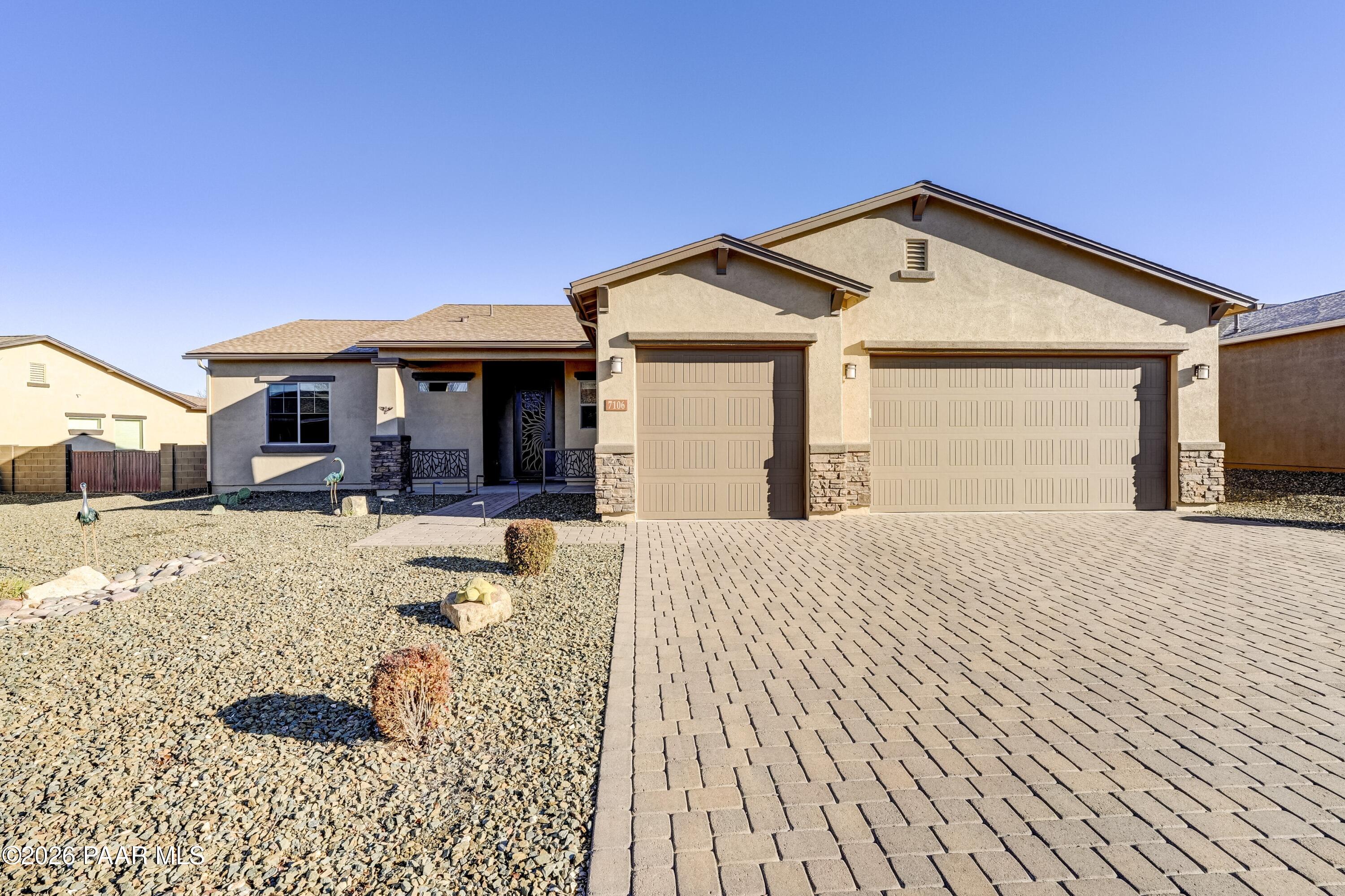 7106 East Prairie Ridge Road Prescott Valley, AZ 86315 - Photo 1 of 27 a front view of a house with a yard