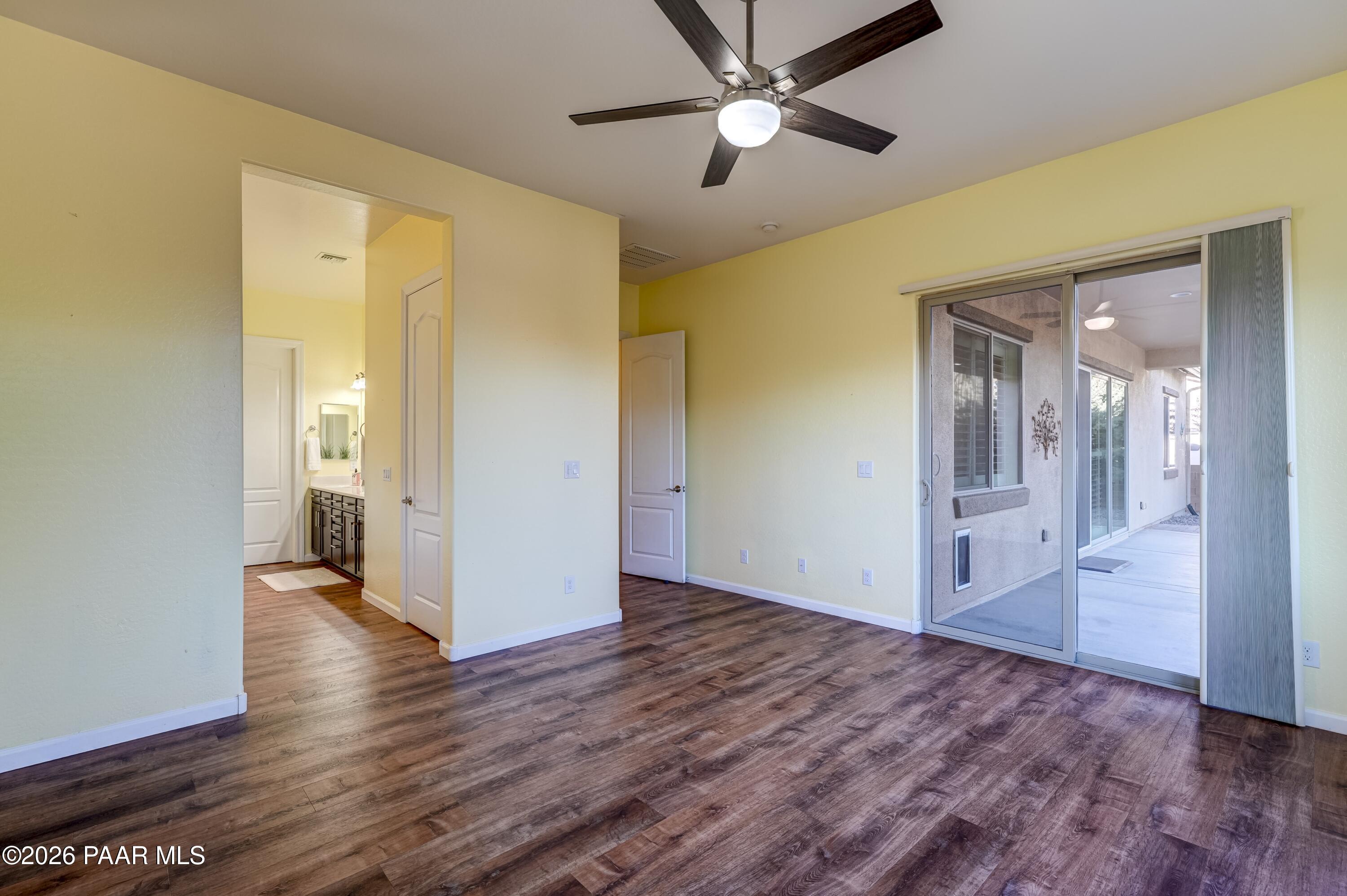 7106 East Prairie Ridge Road Prescott Valley, AZ 86315 - Photo 13 of 27 a view of an empty room and wooden floor