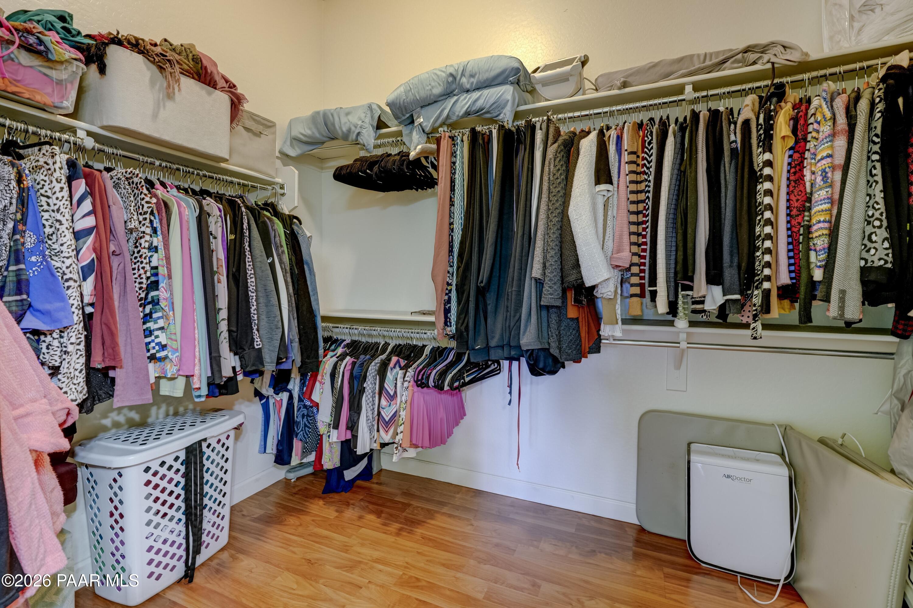 7106 East Prairie Ridge Road Prescott Valley, AZ 86315 - Photo 16 of 27 a view of walk in closet with clothes and shoes
