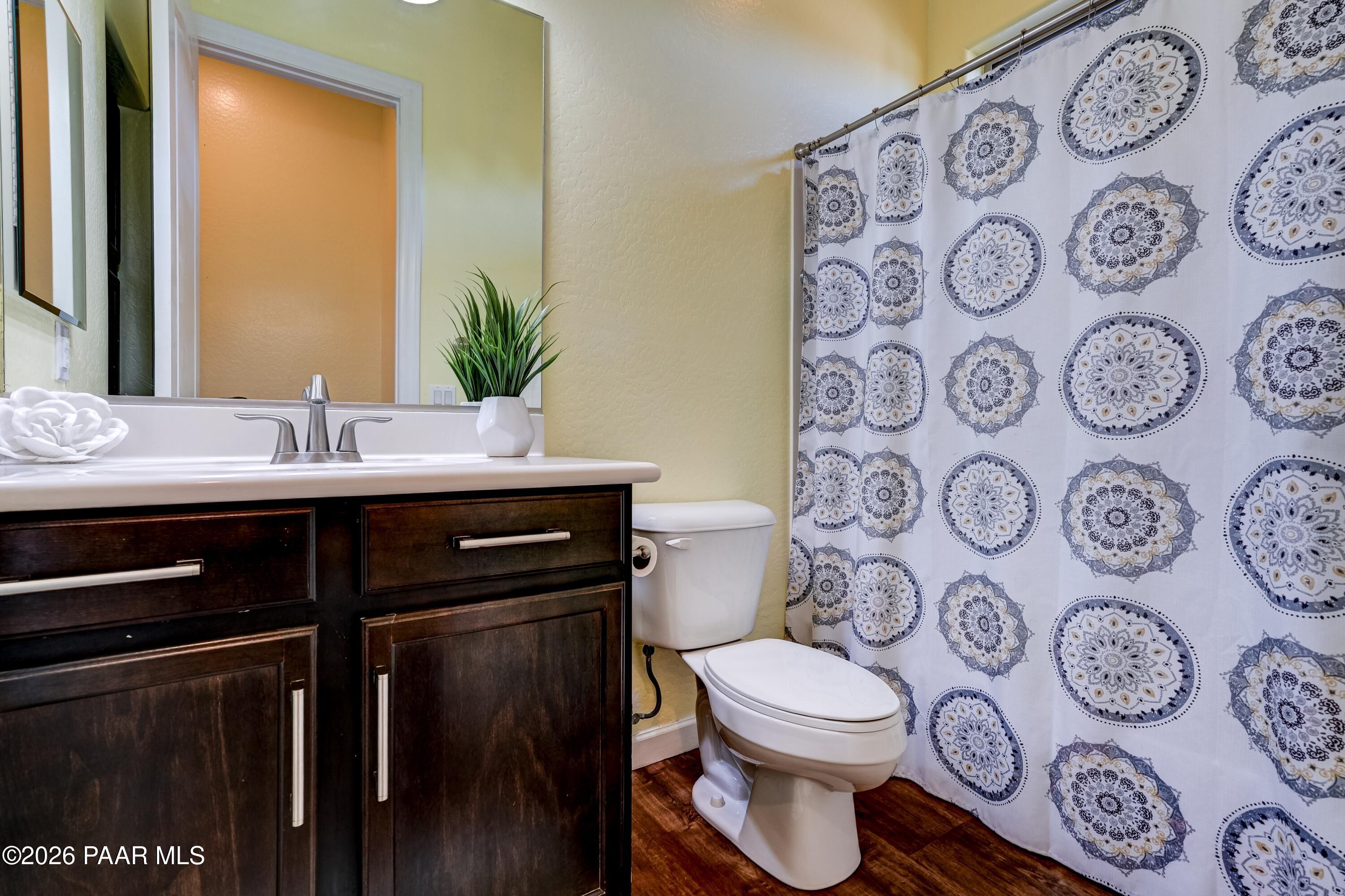 7106 East Prairie Ridge Road Prescott Valley, AZ 86315 - Photo 18 of 27 a bathroom with a sink and a mirror
