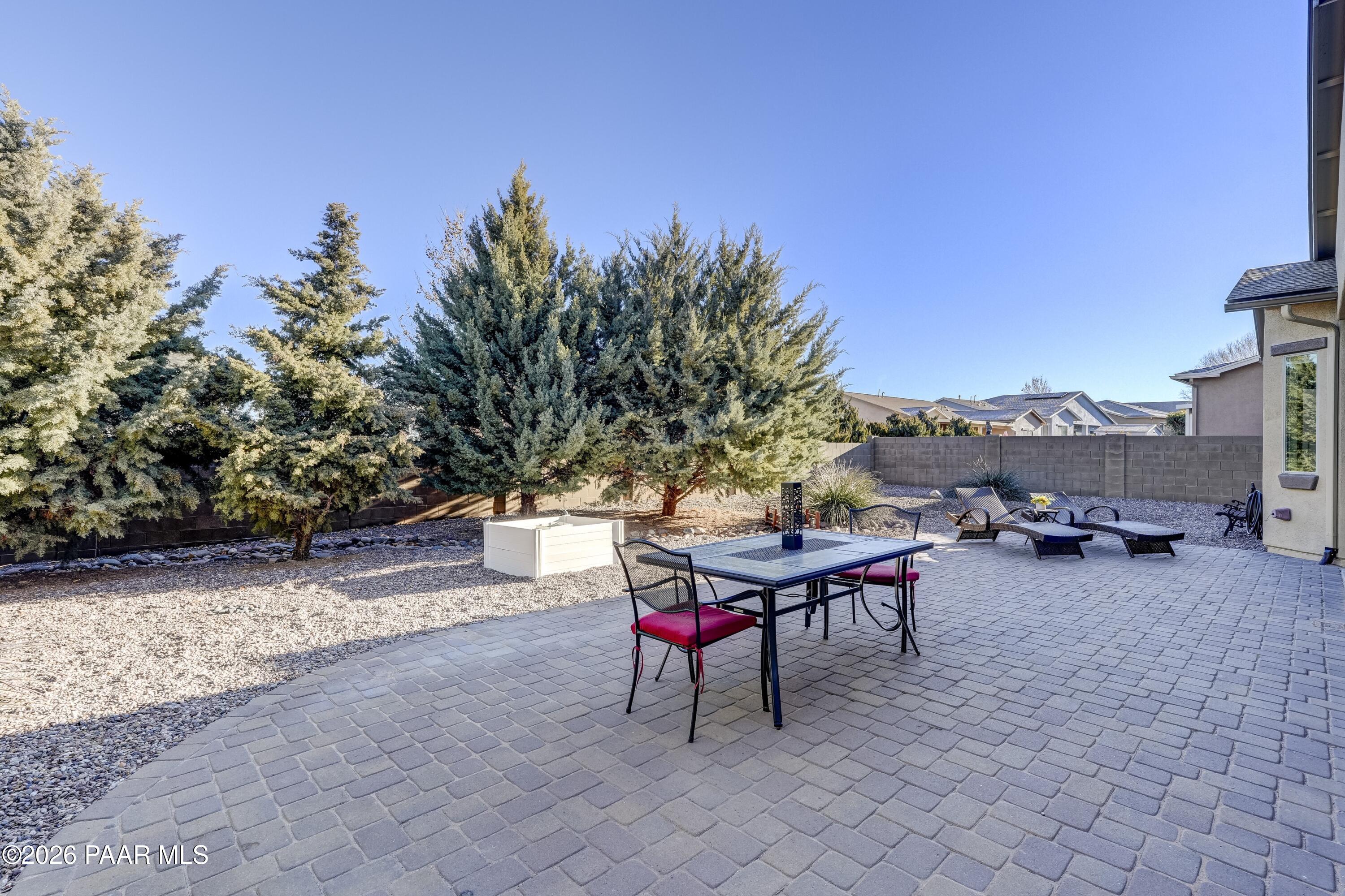 7106 East Prairie Ridge Road Prescott Valley, AZ 86315 - Photo 24 of 27 a view of a backyard with sitting area