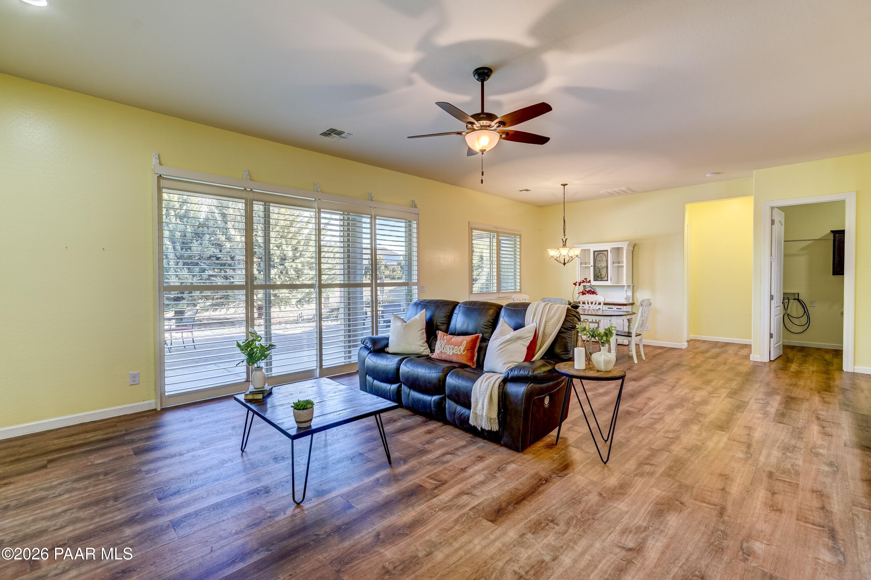 7106 East Prairie Ridge Road Prescott Valley, AZ 86315 - Photo 5 of 27 a living room with furniture and a large window