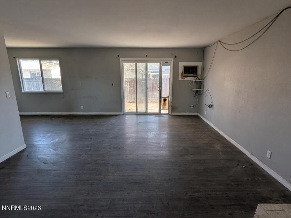 848 C Street Fernley, NV 89408 - Photo 3 of 15 an empty room with wooden floor and windows