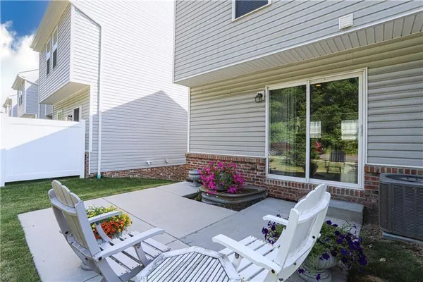 a backyard of a house with seating space