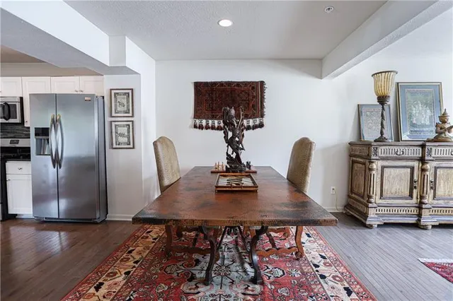a view of kitchen with furniture and wooden floor