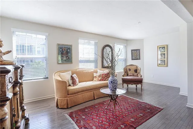 a living room with furniture rug and window