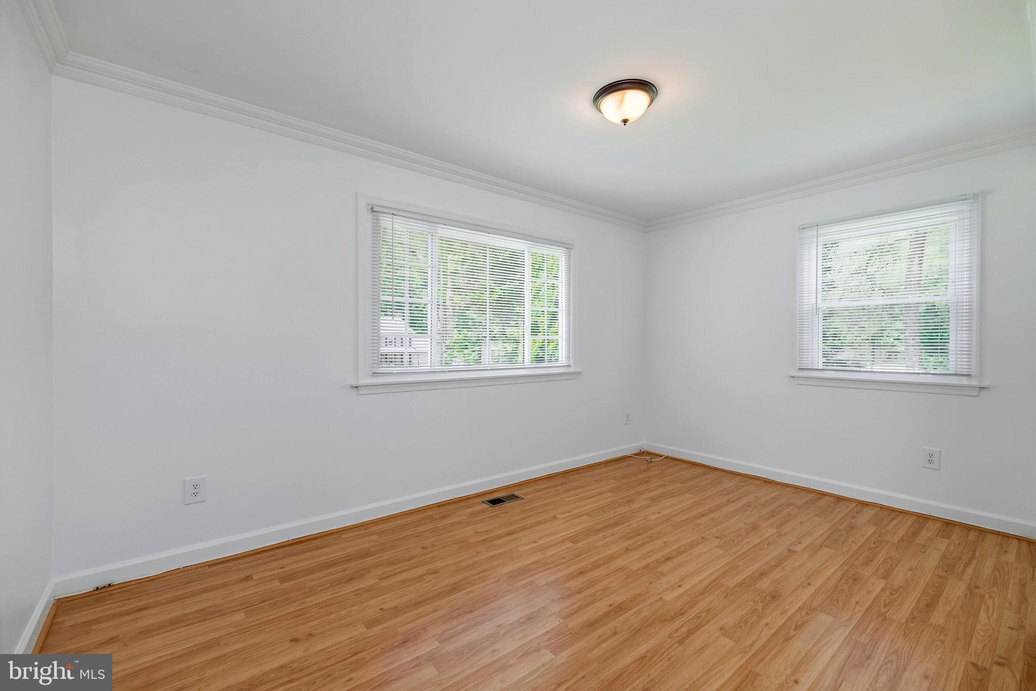 11325 Bacon Race Road Woodbridge, VA 22192 - Photo 20 of 54 wooden floor in an empty room with a window