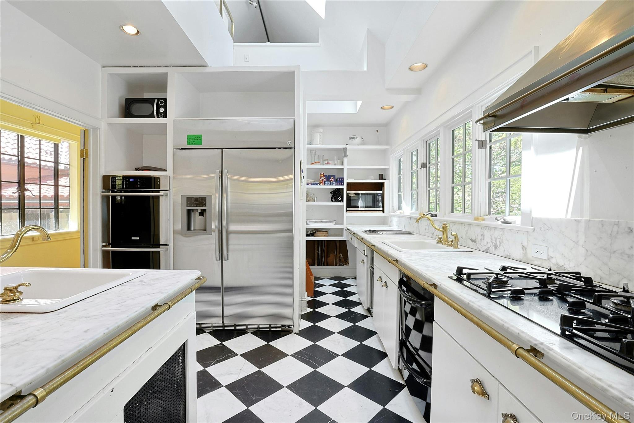 16 Lewis Road Irvington, NY 10533 - Photo 18 of 50 a kitchen with a stove a sink and a refrigerator