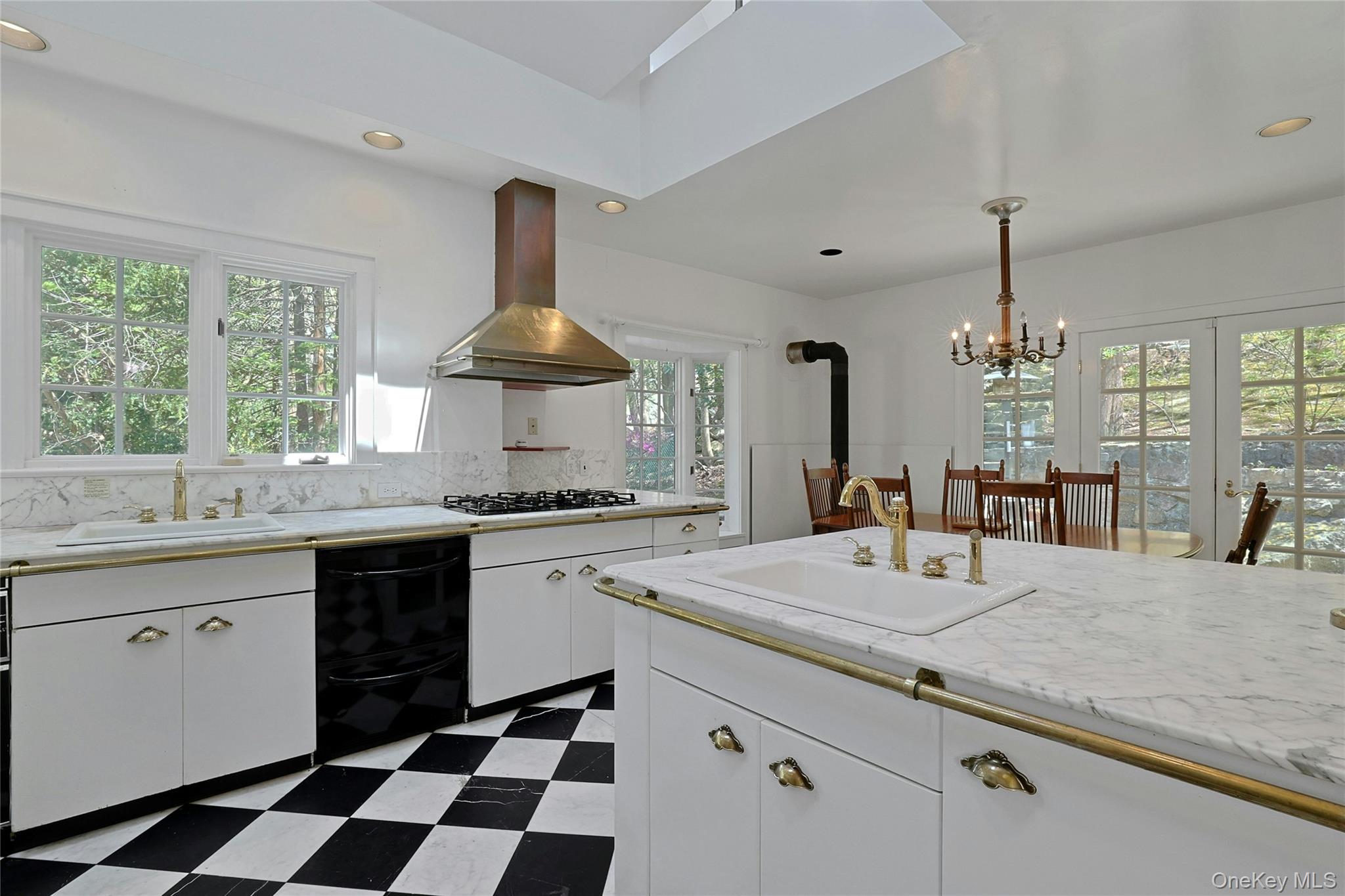 16 Lewis Road Irvington, NY 10533 - Photo 19 of 50 a kitchen with a sink stove and cabinets