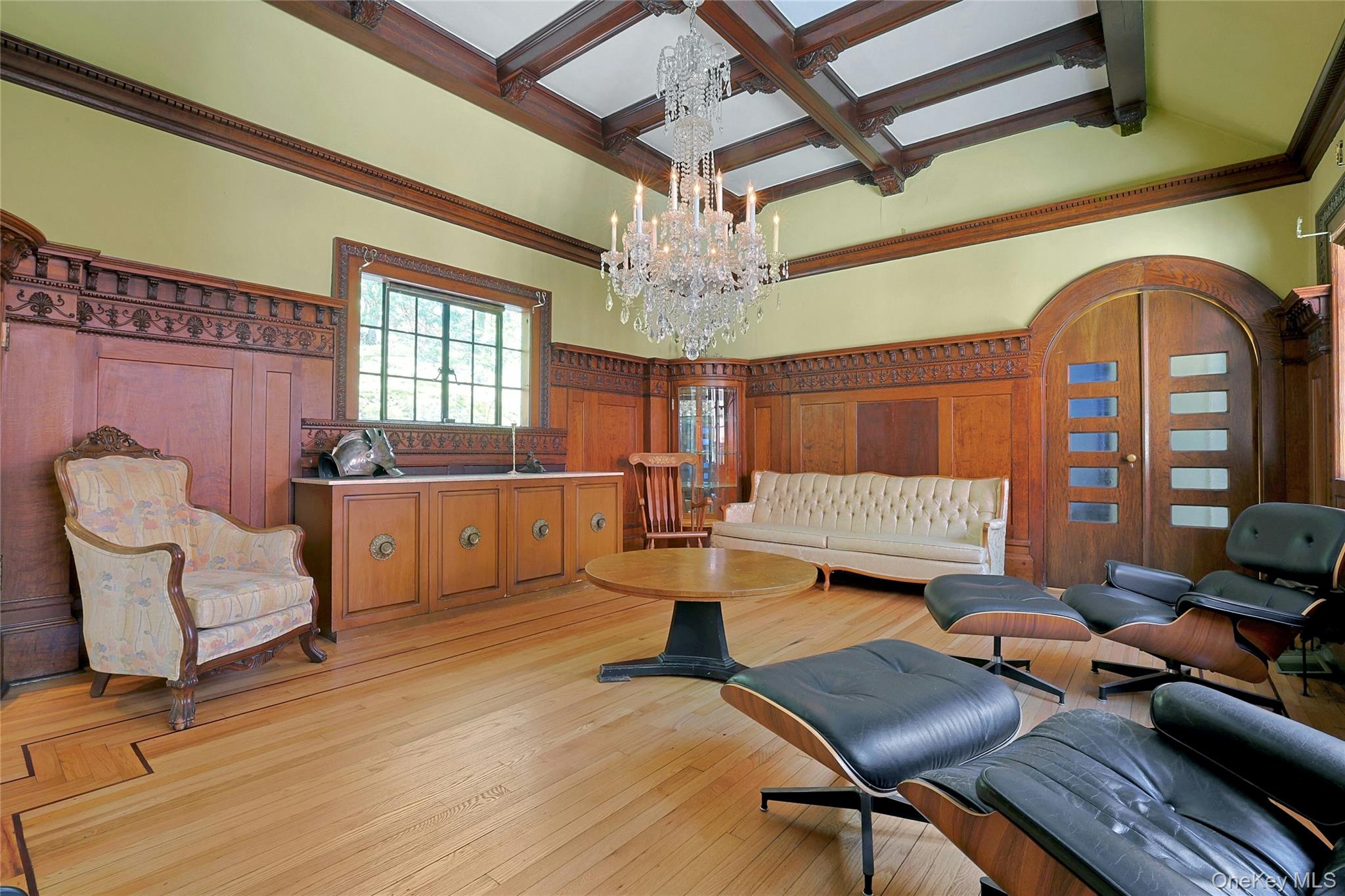 16 Lewis Road Irvington, NY 10533 - Photo 24 of 50 a living room with fireplace furniture and a chandelier
