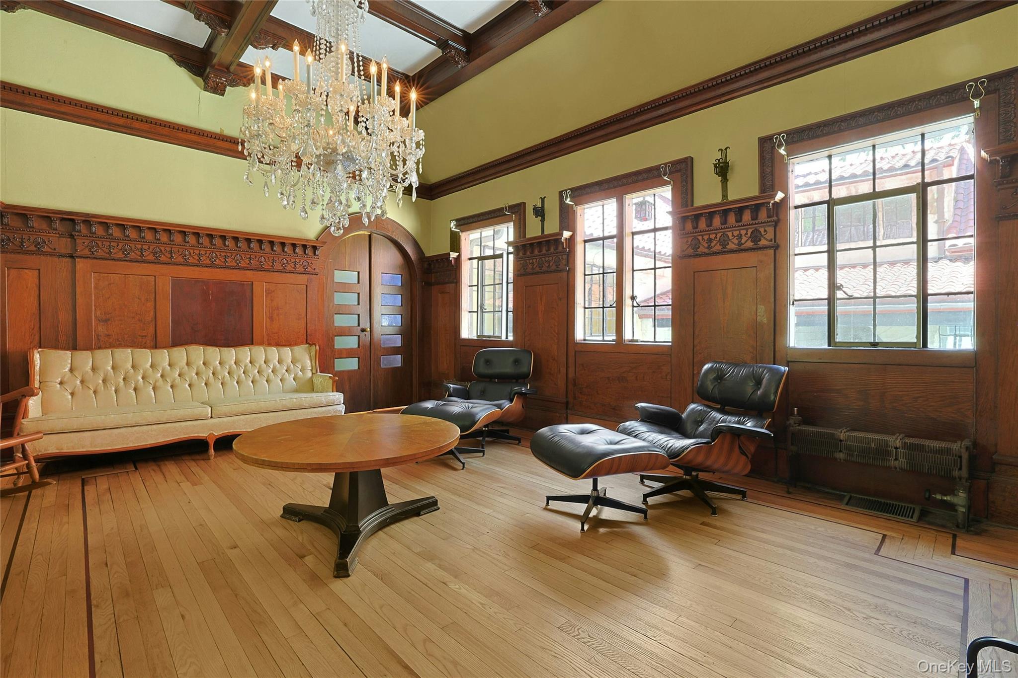 16 Lewis Road Irvington, NY 10533 - Photo 25 of 50 a living room with furniture and a chandelier