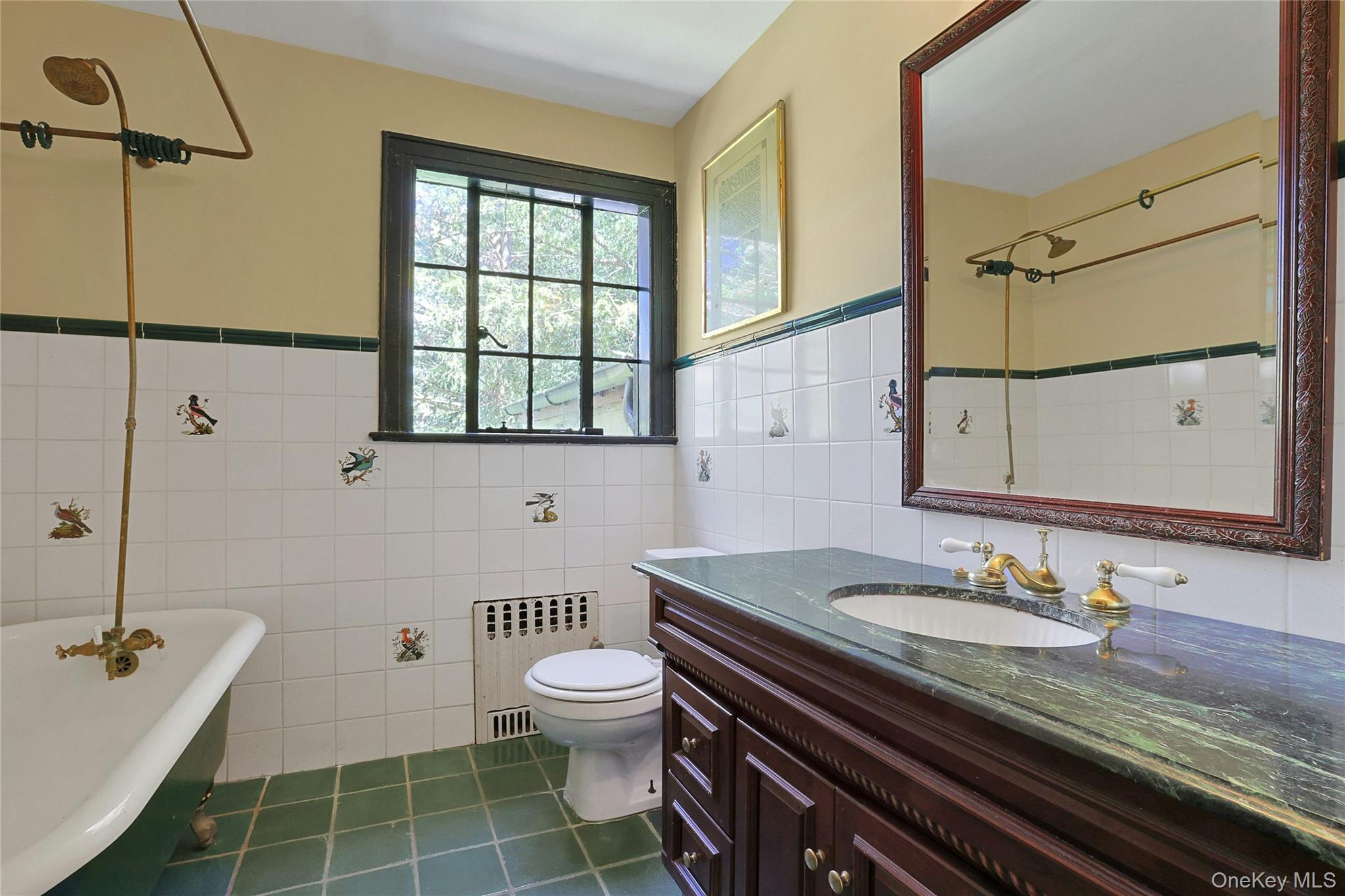 16 Lewis Road Irvington, NY 10533 - Photo 28 of 50 a bathroom with a granite countertop sink a toilet a mirror and shower