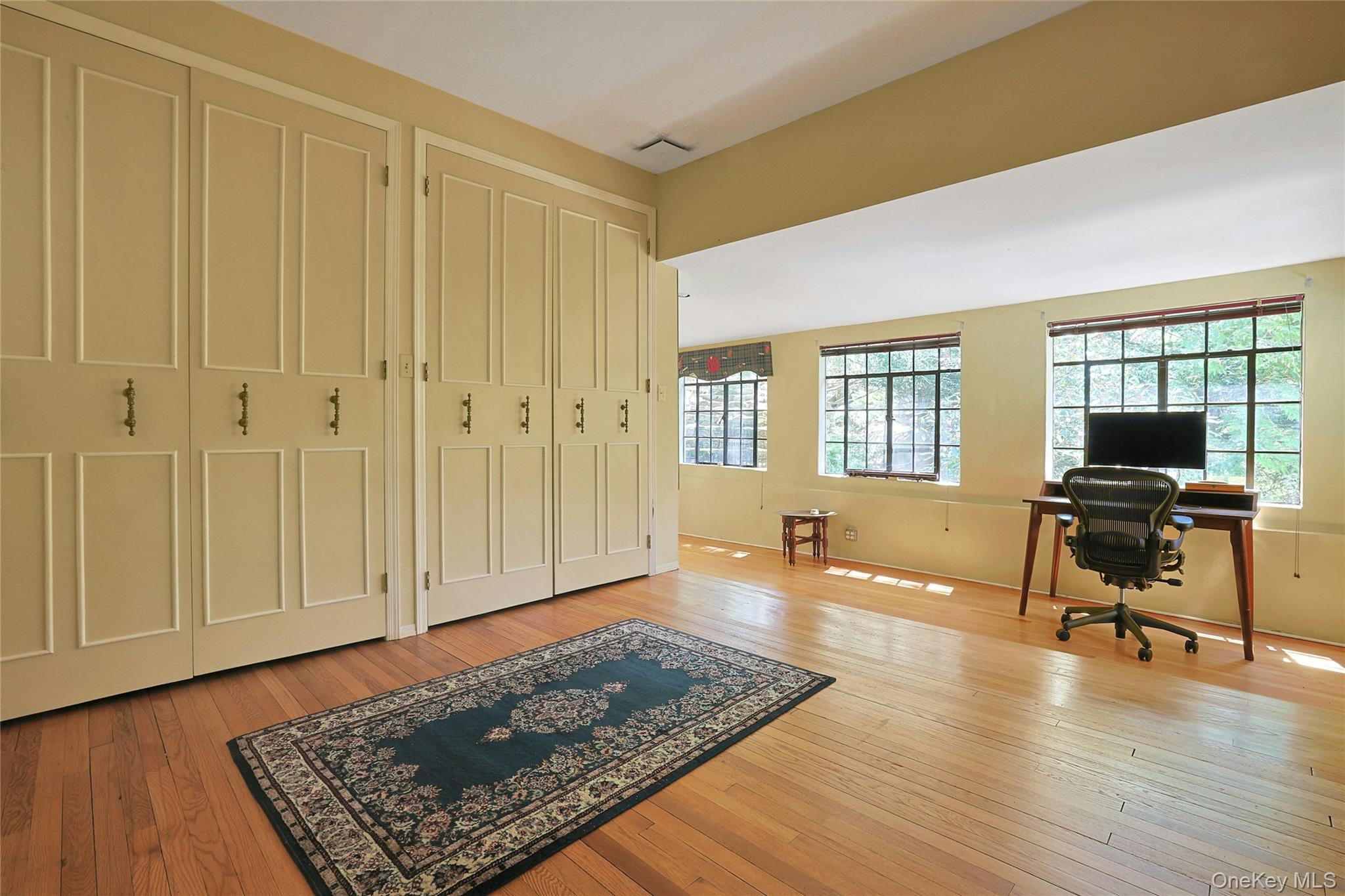 16 Lewis Road Irvington, NY 10533 - Photo 30 of 50 a living room with furniture and a wooden floor