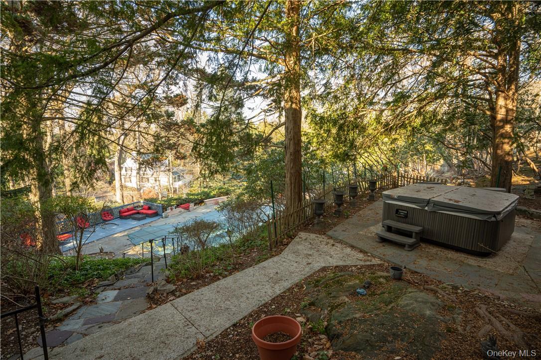 16 Lewis Road Irvington, NY 10533 - Photo 41 of 50 a view of a backyard with plants and trees