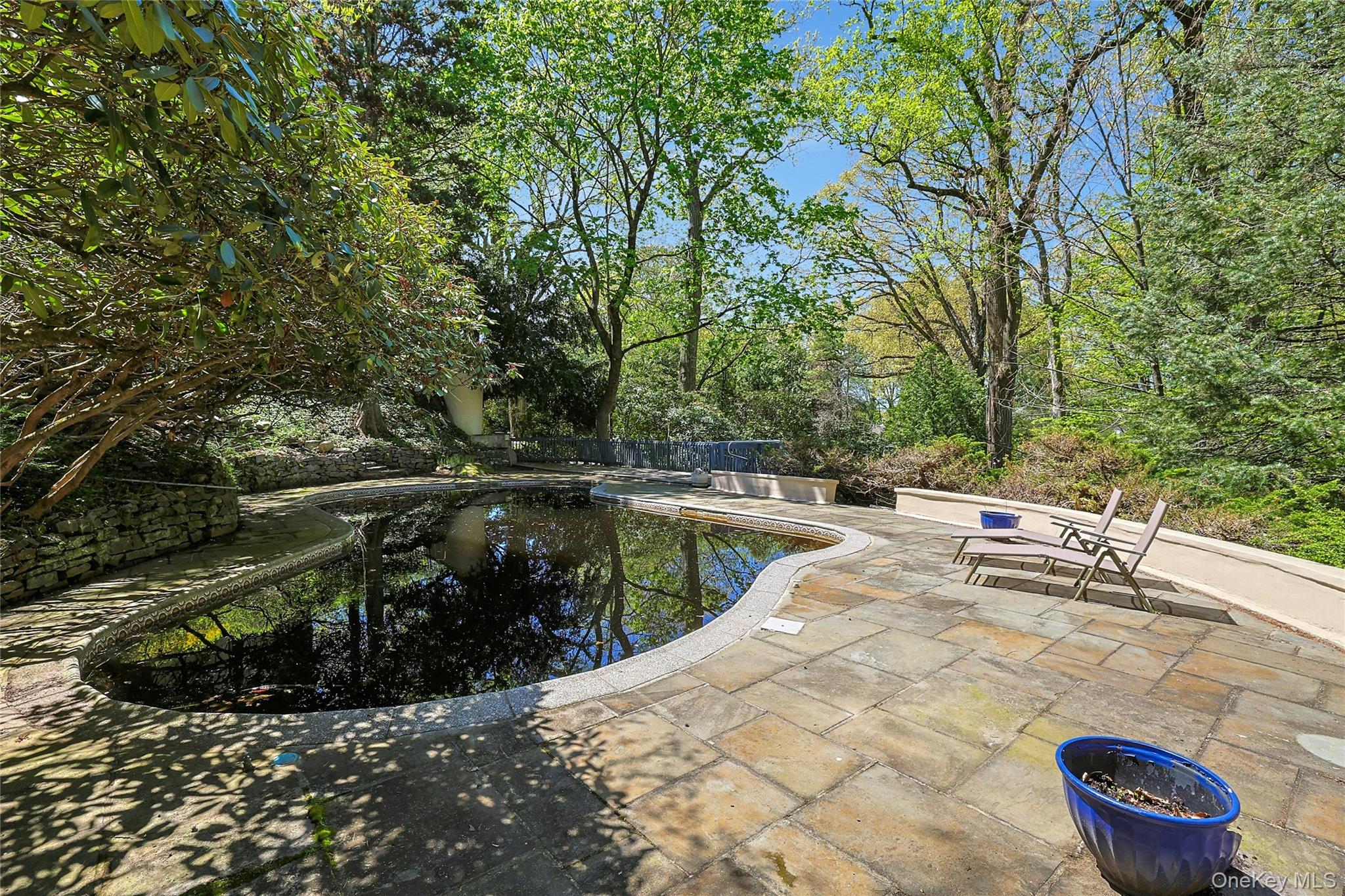 16 Lewis Road Irvington, NY 10533 - Photo 43 of 50 a view of a swimming pool with a patio and a yard