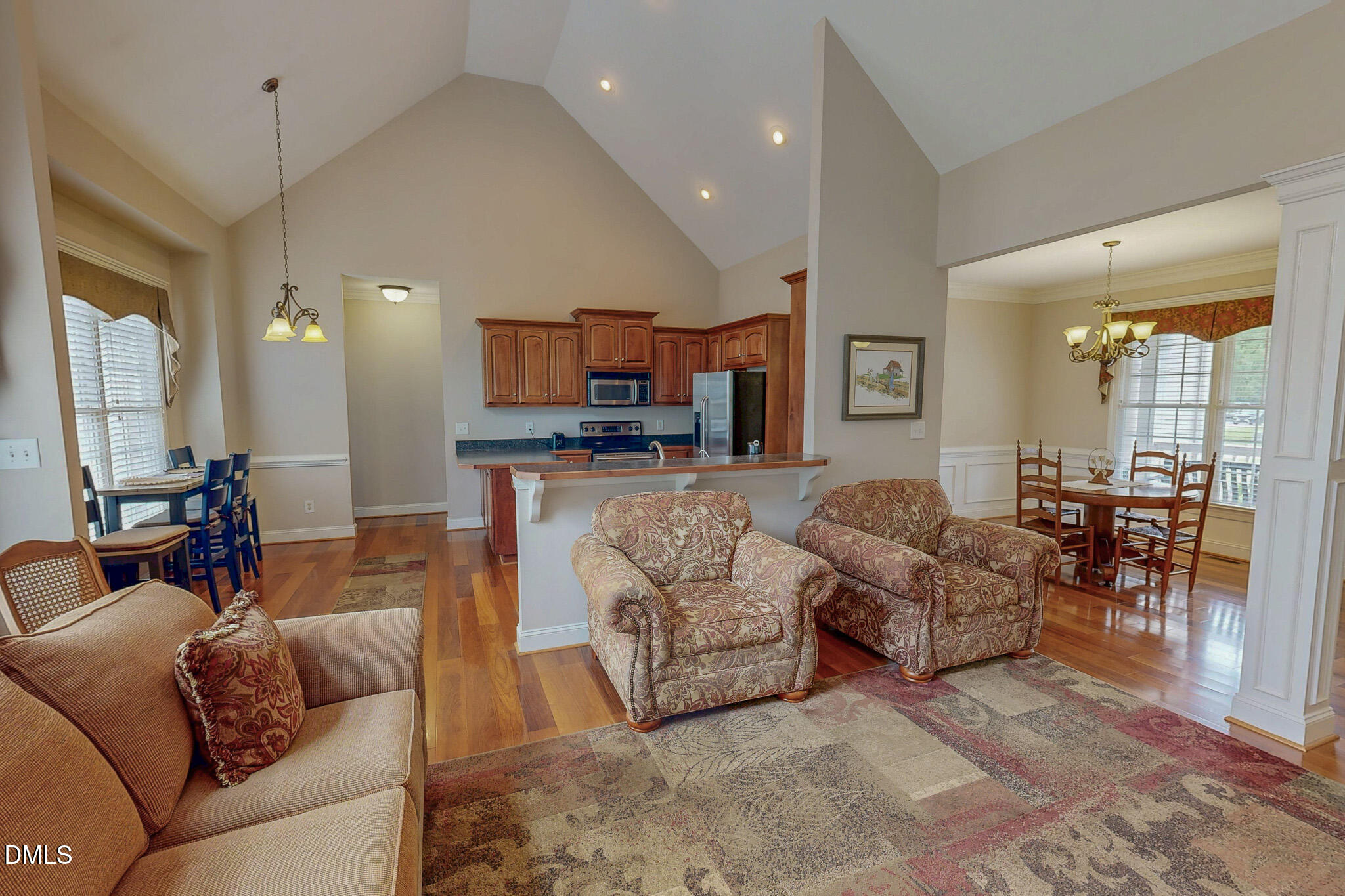 115 Duncan Plantation Road Timberlake, NC 27583 - Photo 3 of 48 a living room with furniture and a wooden floor