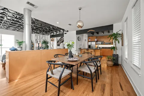 a view of a dining room with furniture window and wooden floor