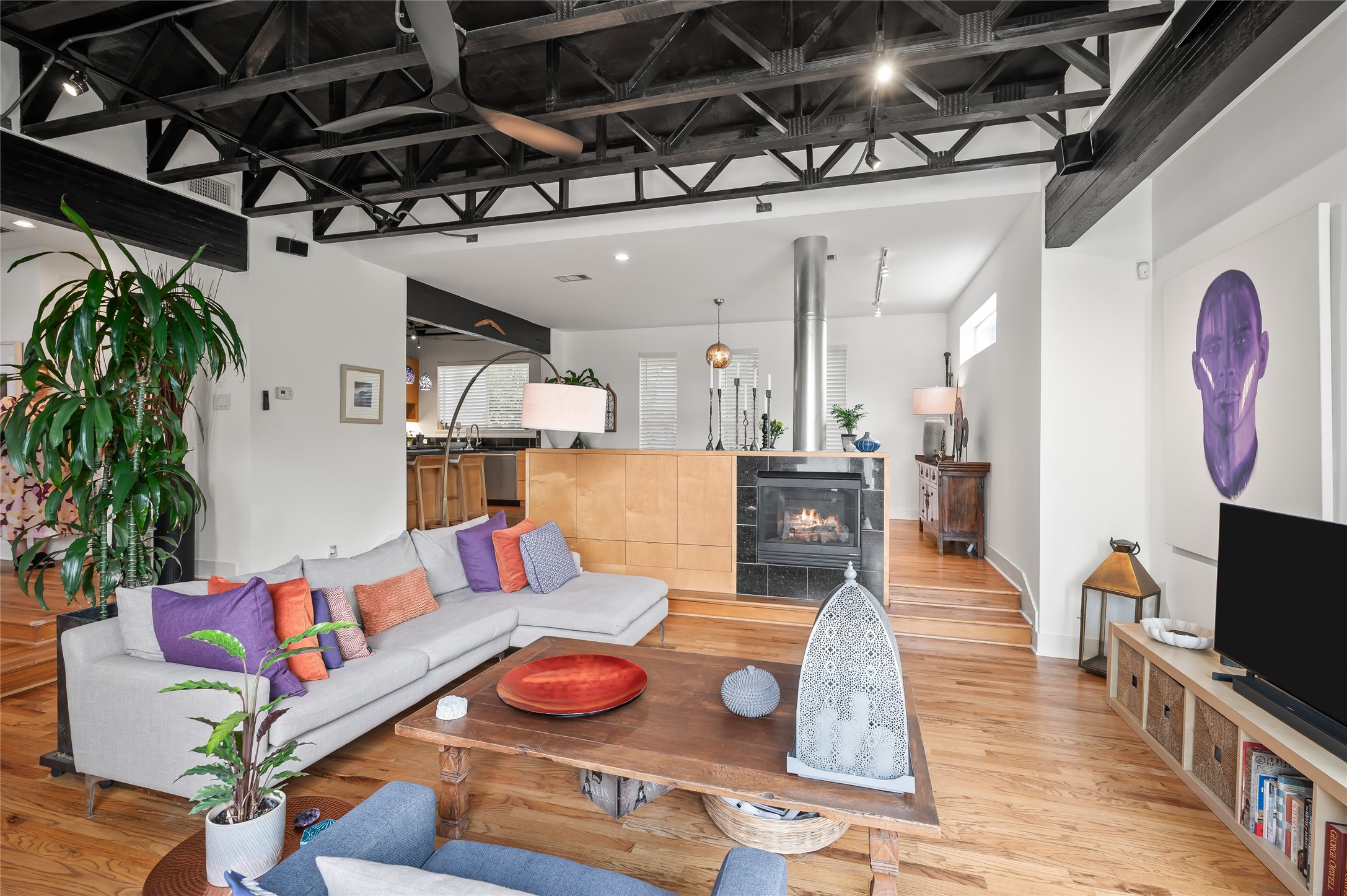 2303 Whitney Street, Unit A Houston, TX 77006 - Photo 18 of 34 The gaslog fireplace bring a sense of coziness and warmth to such an eclectic space.