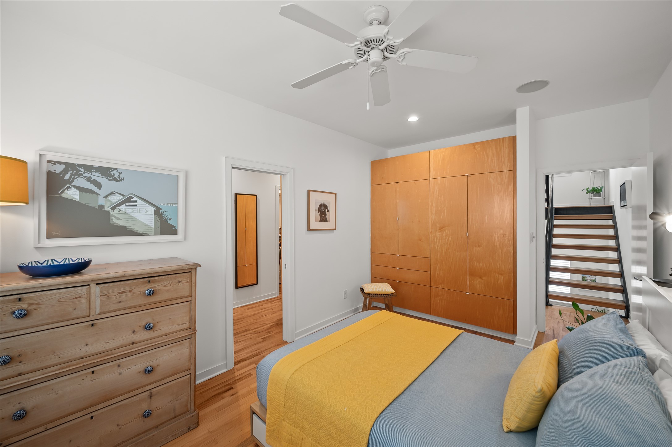 2303 Whitney Street, Unit A Houston, TX 77006 - Photo 25 of 34 Also located on the third floor is the last of the bedrooms. Built-in storage and a shared hallway to the laundry room.