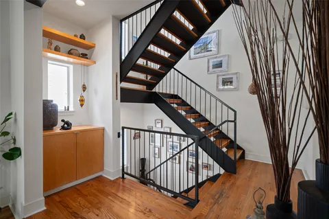 a view of entryway with wooden floor and stairs