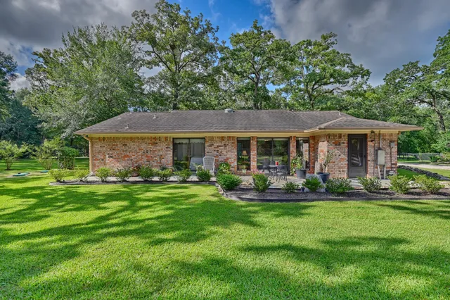 a front view of a house with a yard table and chairs