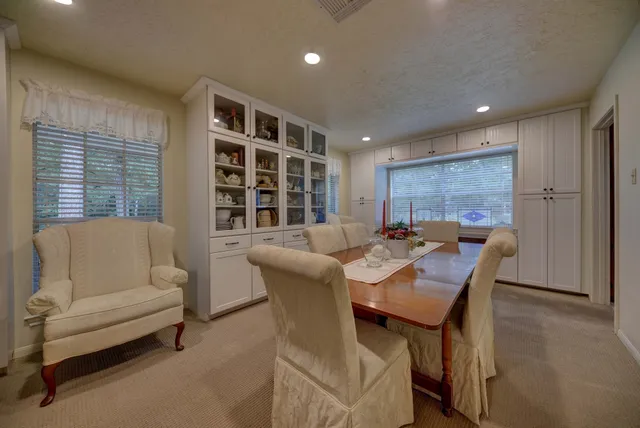 a view of a dining room with furniture and window