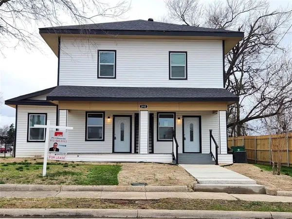 a front view of a house with garage