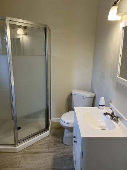 3112 Stonewall Street, Unit 3 Greenville, TX 75401 - Photo 2 of 5 a bathroom with a sink and a toilet