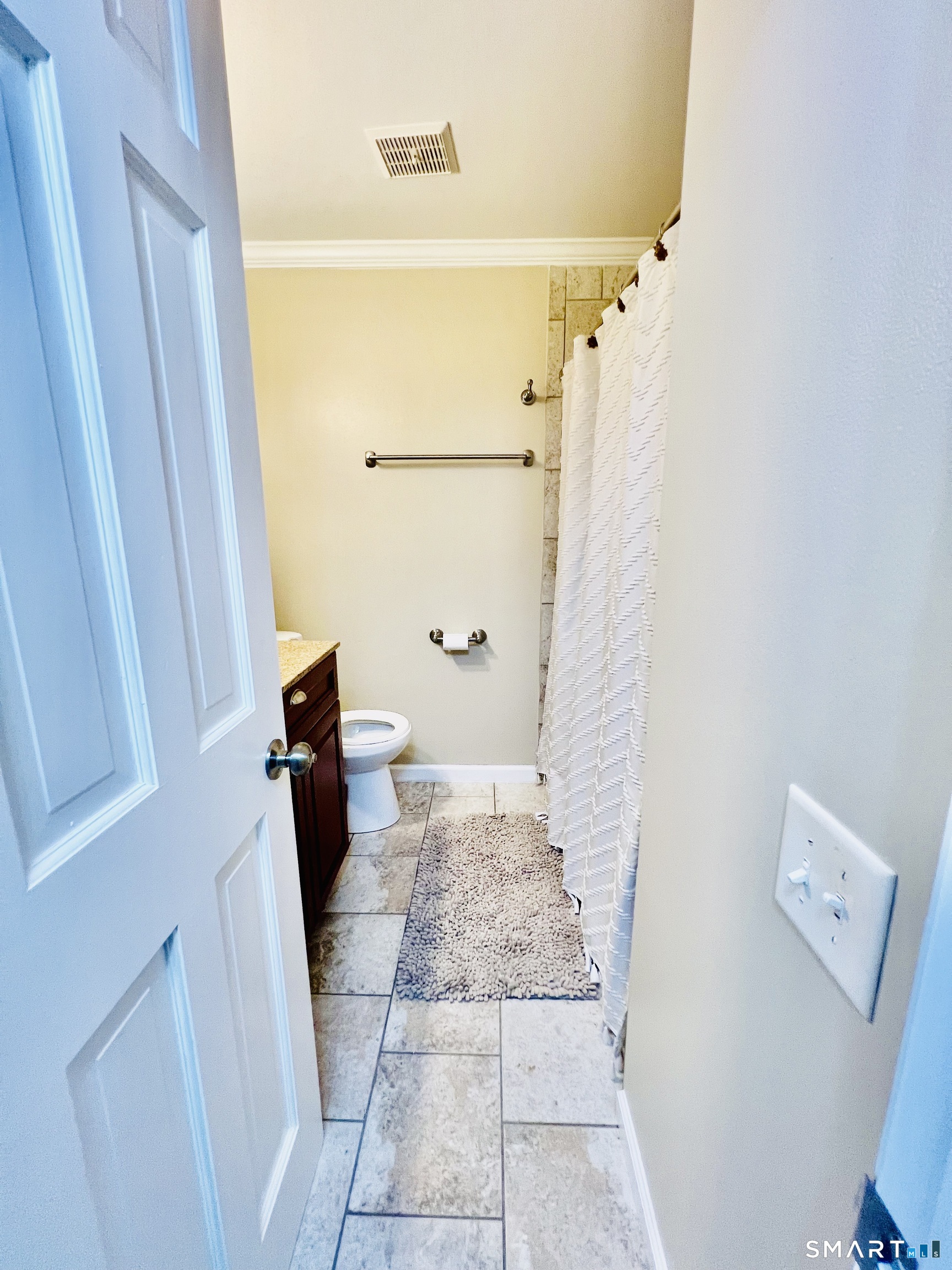 55 Mill Plain Road, Unit 297 Danbury, CT 06811 - Photo 6 of 8 a bathroom with a sink and toilet