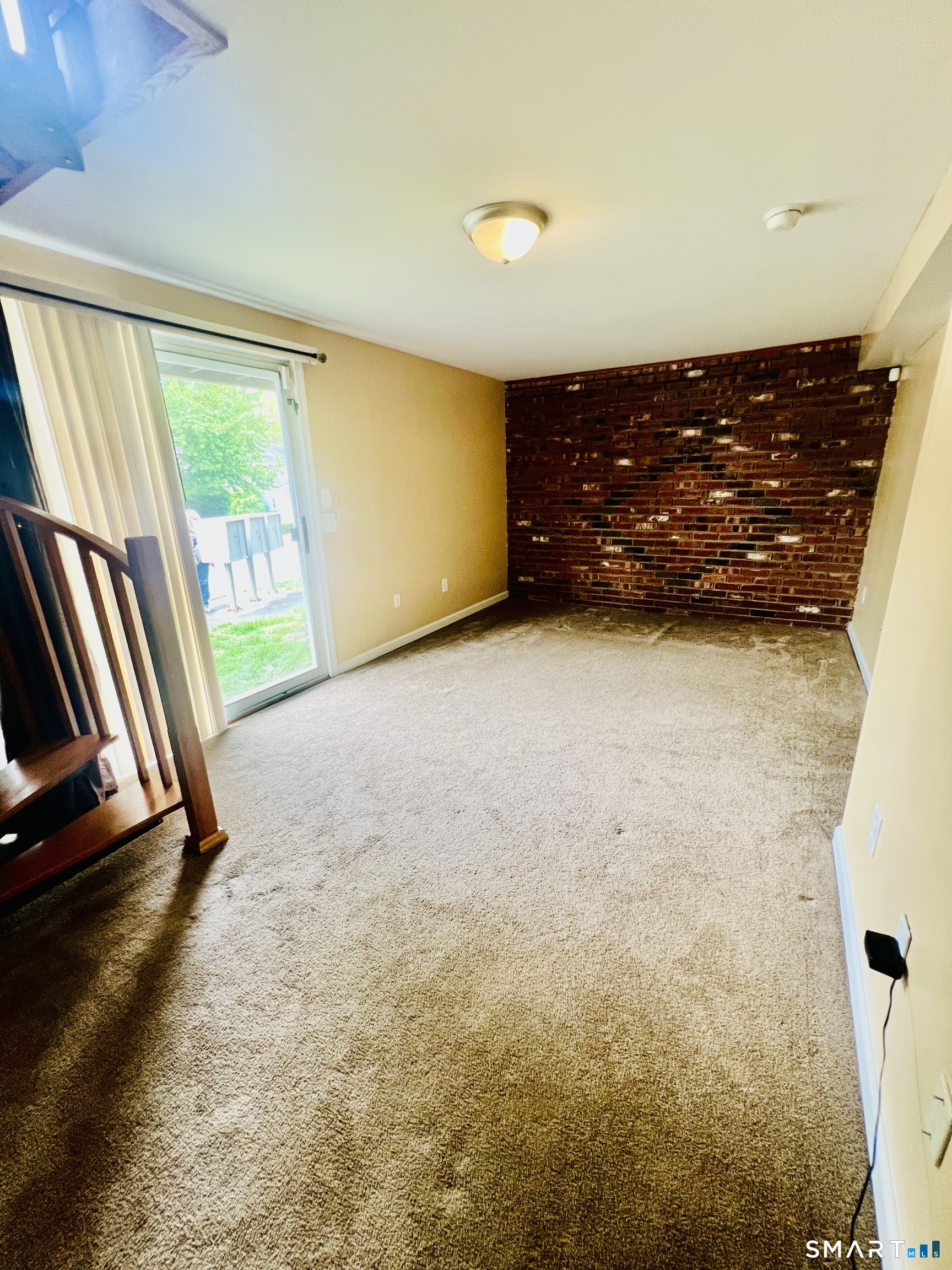 55 Mill Plain Road, Unit 297 Danbury, CT 06811 - Photo 7 of 8 a view of an empty room and a window